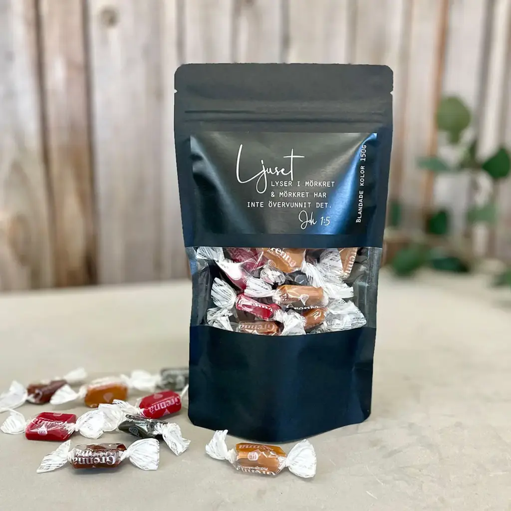 Presentgodis – Ljuset lyser i mörkret, svart