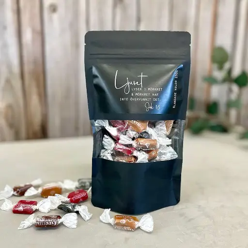 [912.012] Presentgodis – Ljuset lyser i mörkret, svart